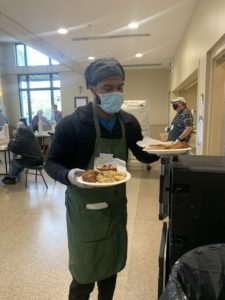 Cedric Mullins serving food at Our Daily Bread Employment Center