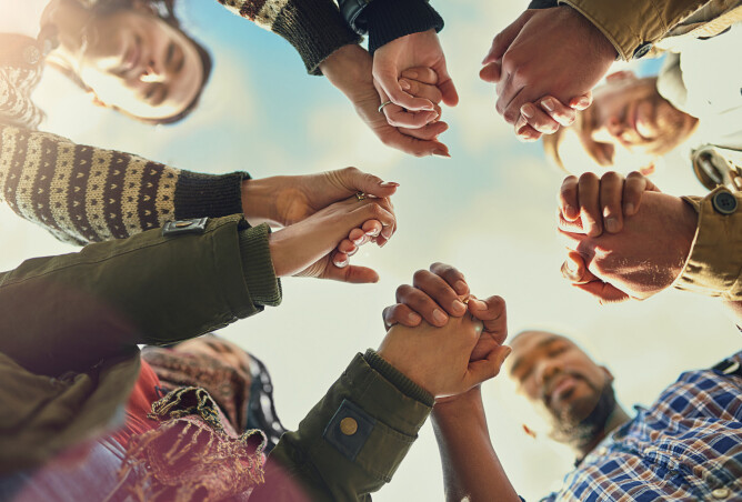 People Holding Hands in Prayer
